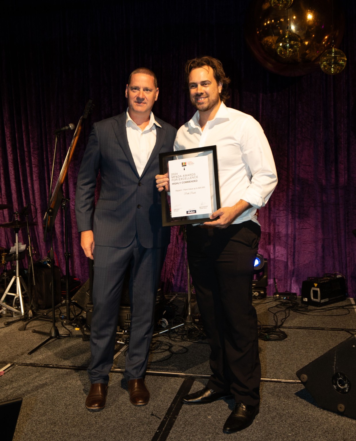 Corey Hicks receiving a 2024 Master Painters award