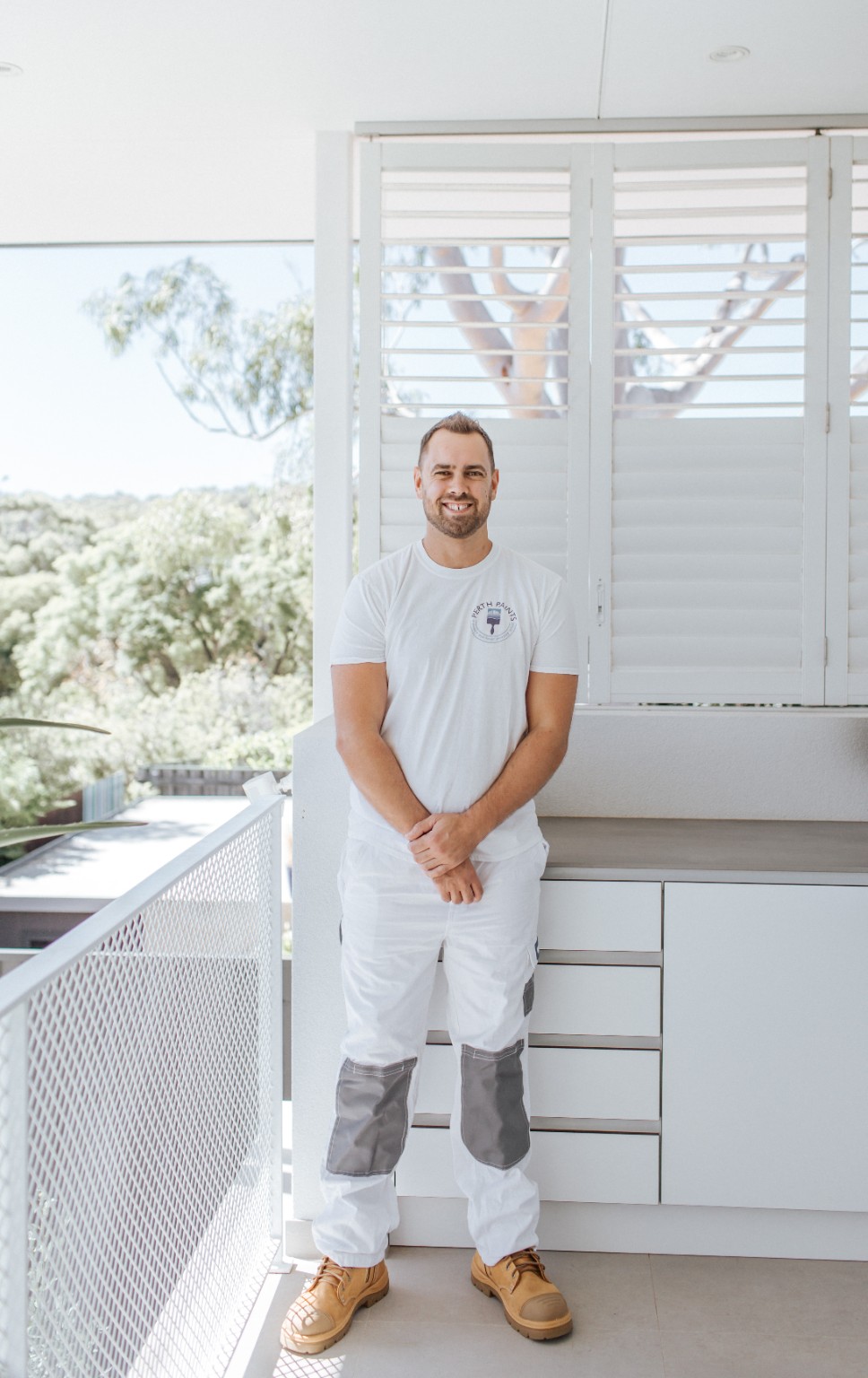 Corey Hicks in his painting workwear at a completed home